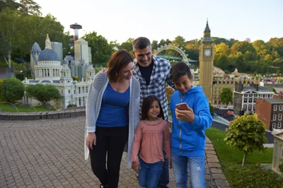 Family using LEGOLAND app in Miniland at the LEGOLAND Windsor Resort