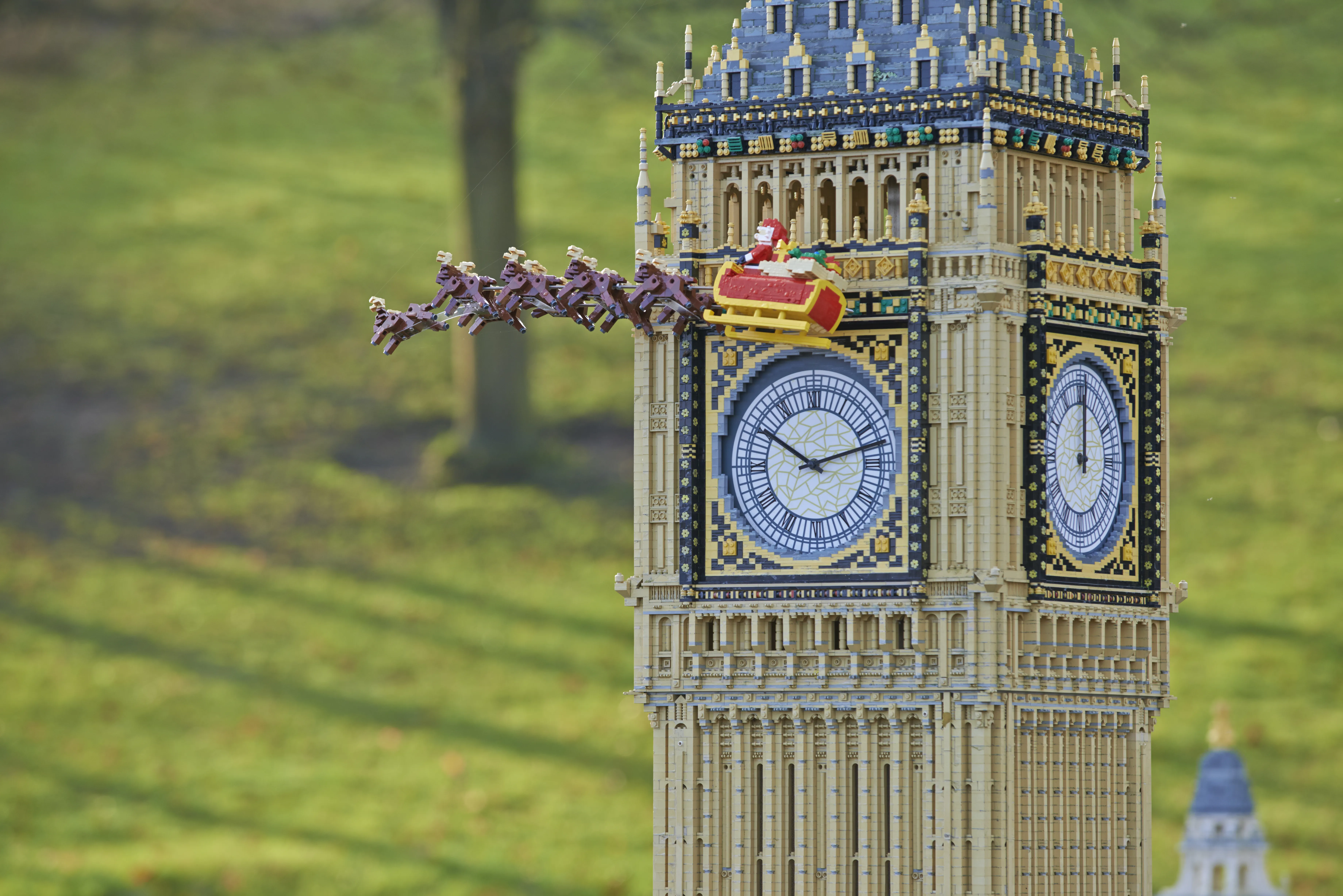 LEGO Father Christmas, sleigh and reindeer flying past Big Ben