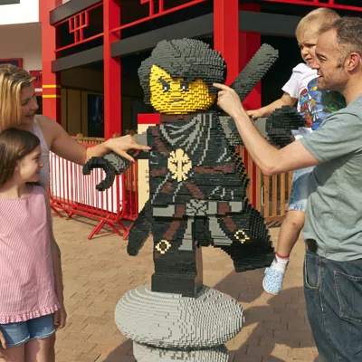 Family with LEGO model of Cole from LEGO NINJAGO
