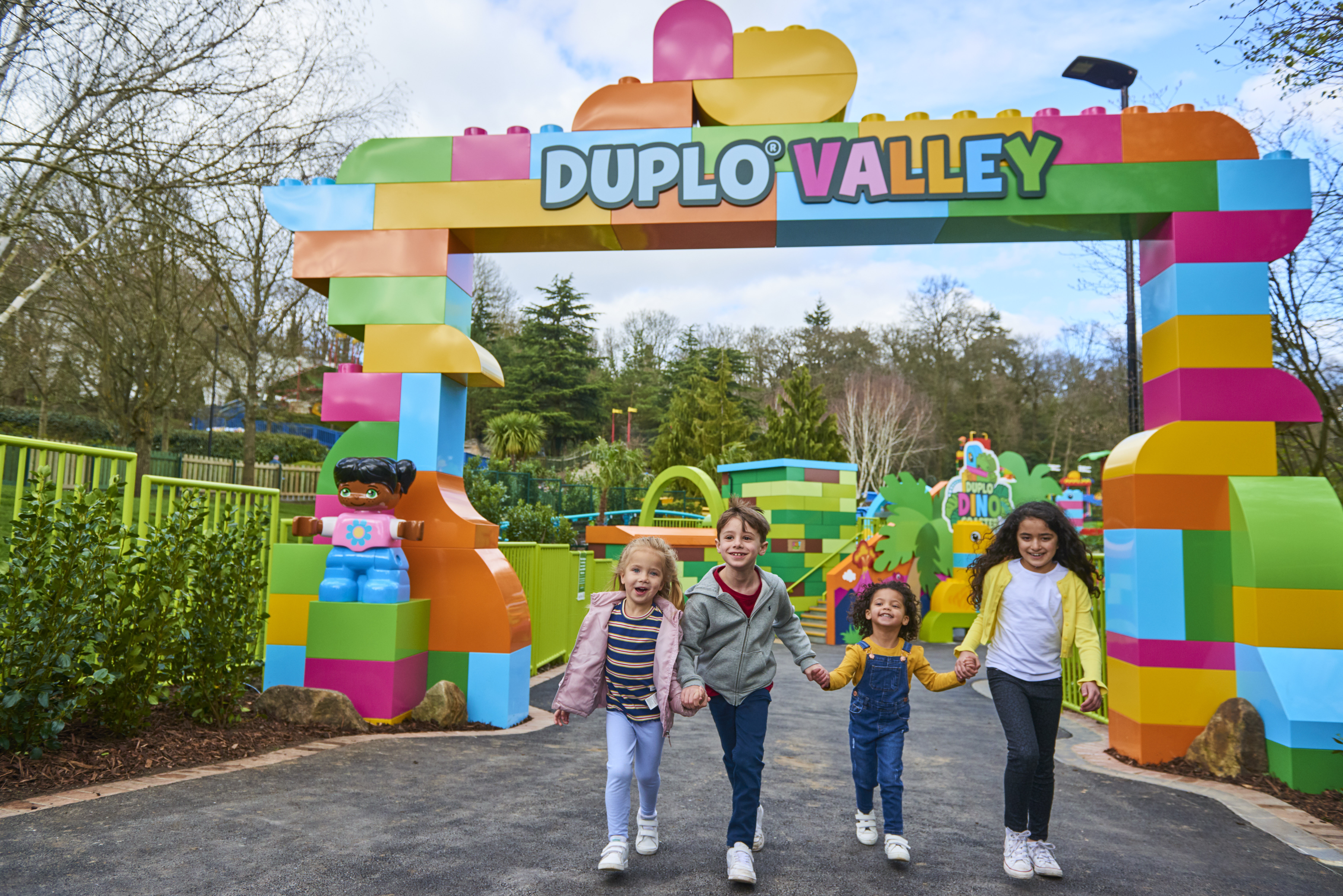 Children running through DUPLO Valley Portal