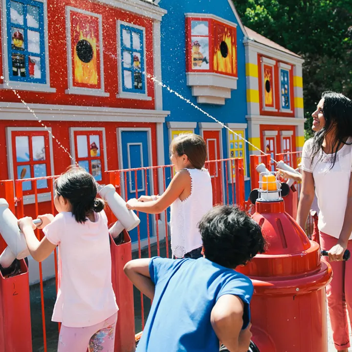 Families shooting water at Fire Academy at the LEGOLAND Windsor Resort