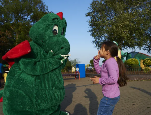 Girl meeting Ollie the Dragon