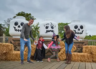 Family With Skeleton Heads At Brick Or Treat