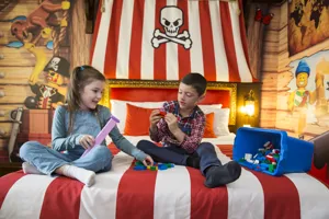 Kids playing with LEGO in a Pirate Room at the LEGOLAND Resort Hotel