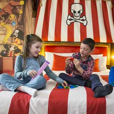 Kids playing with LEGO in a Pirate Room at the LEGOLAND Resort Hotel