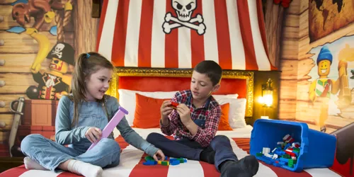Kids playing with LEGO in a Pirate Room at the LEGOLAND Resort Hotel