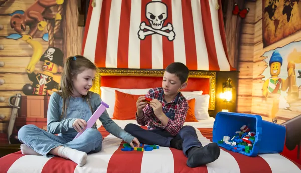 Kids playing with LEGO in a Pirate Room at the LEGOLAND Resort Hotel