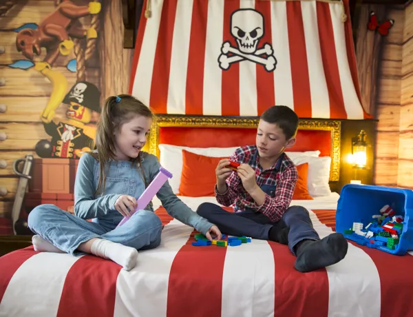 Kids playing with LEGO in a Pirate Room at the LEGOLAND Resort Hotel