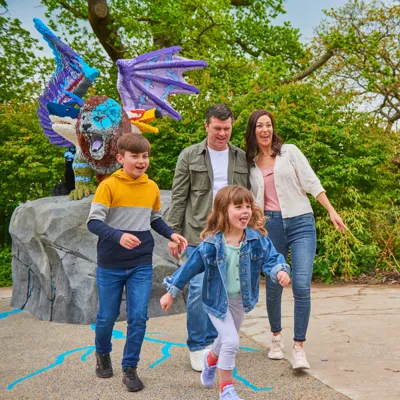Family in front of LEGO Chimera model