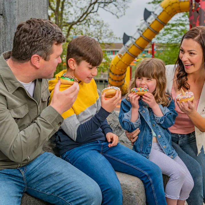 Family enjoying beastly-themed doughnuts from Beastly Bites