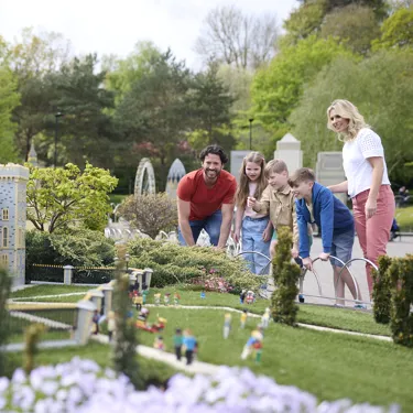 Family looking at Windsor Castle model in Miniland at LEGOLAND Windsor Resort