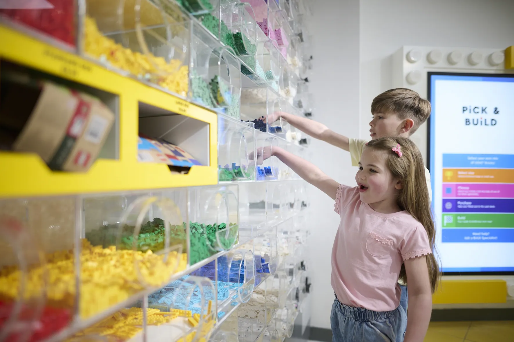Children picking LEGO bricks in The LEGO Store