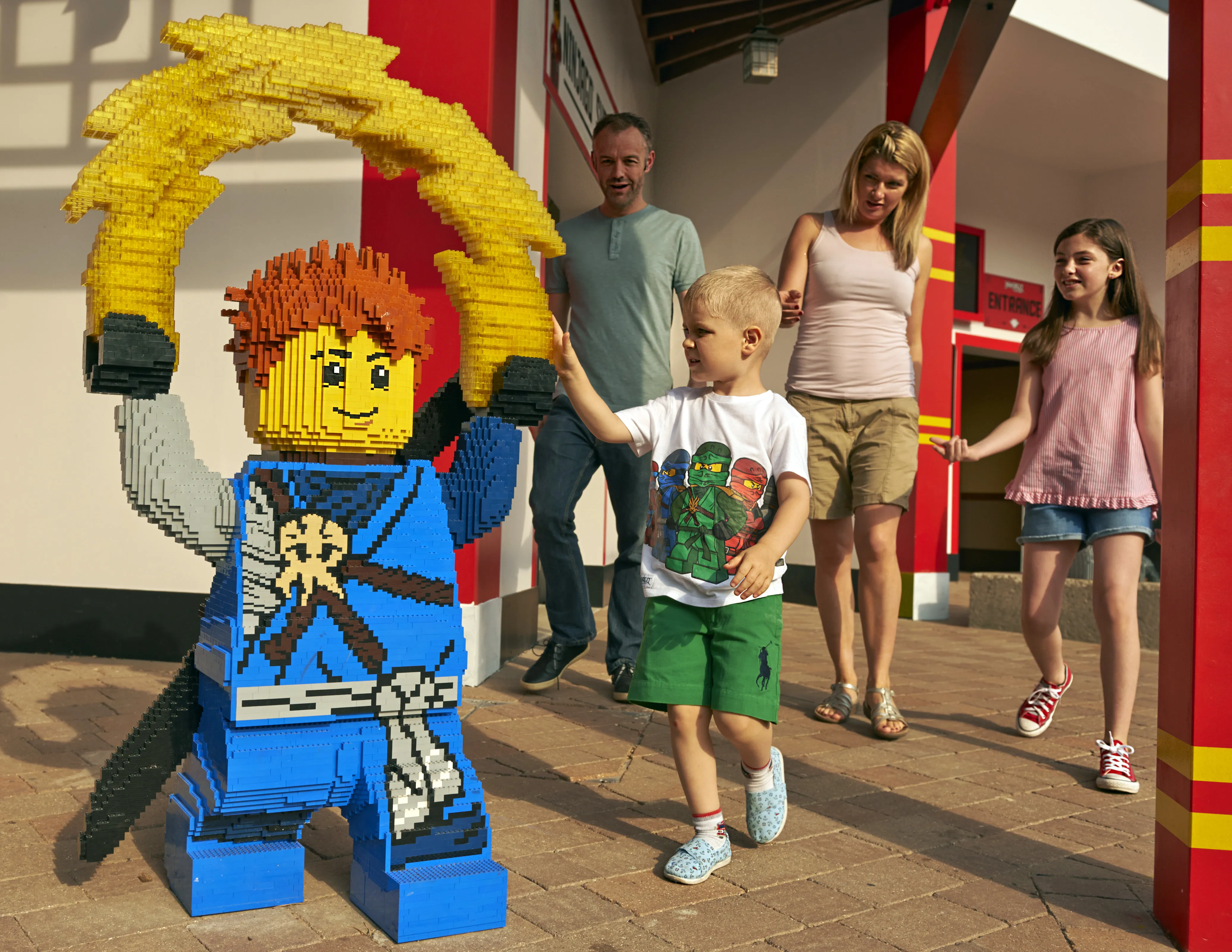 Family with LEGO model of Jay from LEGO NINJAGO