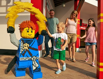Family with LEGO model of Jay from LEGO NINJAGO