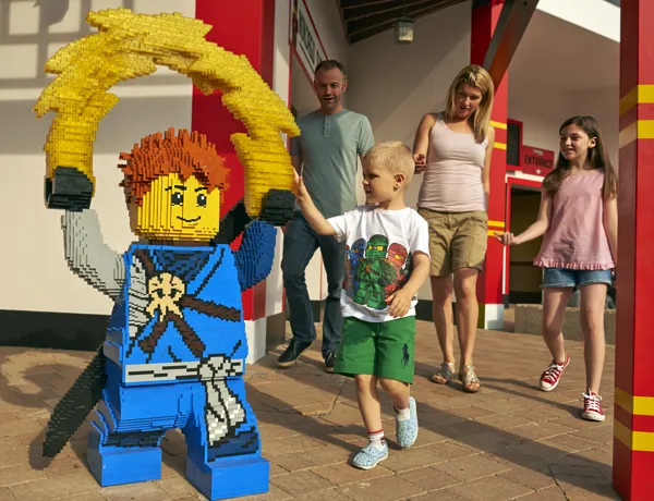 Family with LEGO model of Jay from LEGO NINJAGO