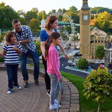 Family looking at London landmarks in Miniland at the LEGOLAND Windsor Resort