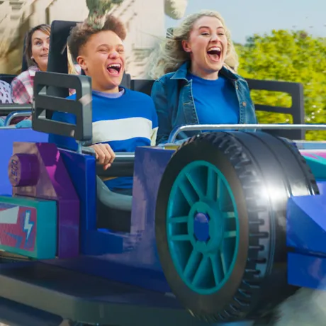 Family enjoying Minifigure Speedway Rollercoaster with "popcorn power" effect