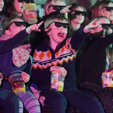 Children pointing at 4D movie at LEGO Studios 4D