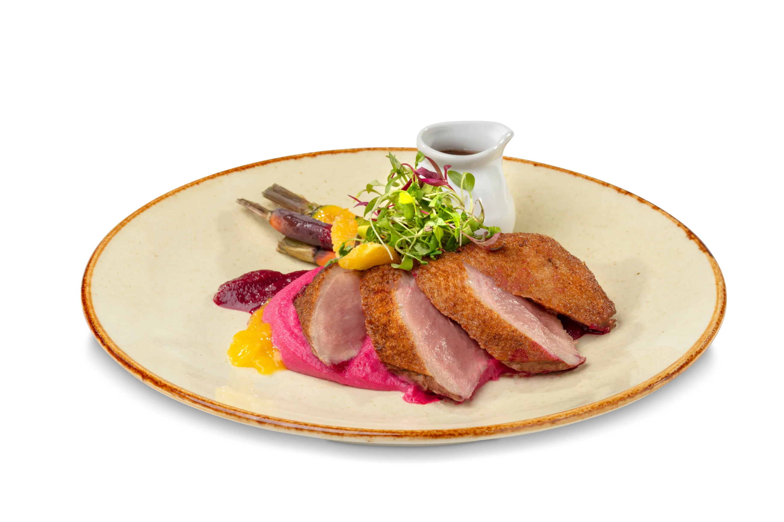 Duck Breast - Pan seared Duck Breast served with creamy beetroot mashed potatoes, steamed heritage carrots, an orange glaze & a red wine Jus.