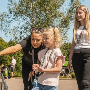 A family being escorted by a VIP Host through Miniland at the LEGOLAND Windsor Resort