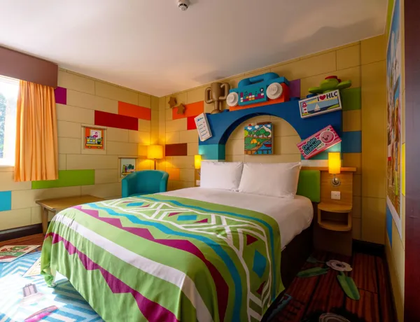 Double bed in the adult's area of a LEGO Friends themed room in the LEGOLAND Resort Hotel