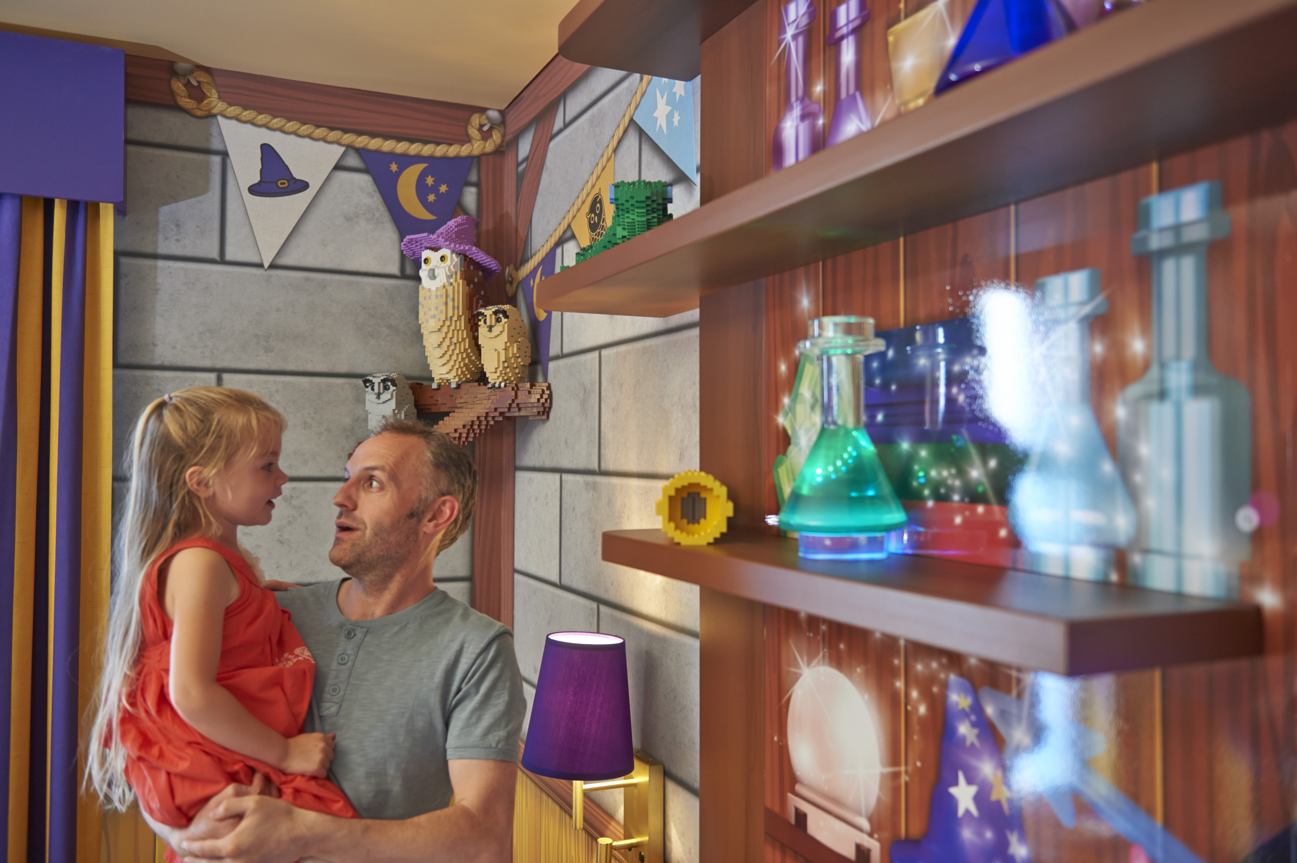 Father & Daughter looking at models in Wizard's Room