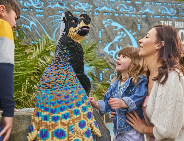Family looking at Peadog in LEGO® MYTHICA at the LEGOLAND® Windsor Resort