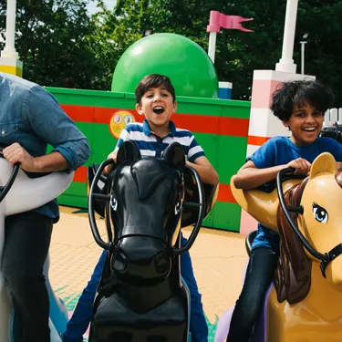 Families laughing and smiling on Mia's Riding Adventure