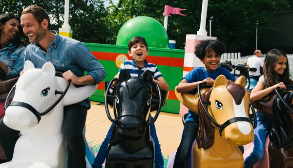 Families laughing and smiling on Mia's Riding Adventure