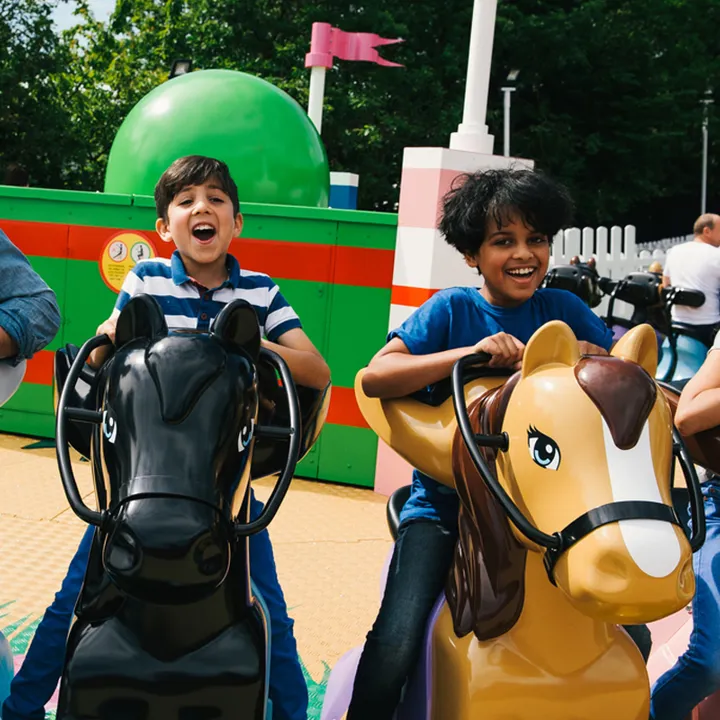 Families laughing and smiling on Mia's Riding Adventure