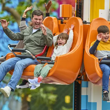 Family enjoying Fire & Ice Freefall in LEGO MYTHICA