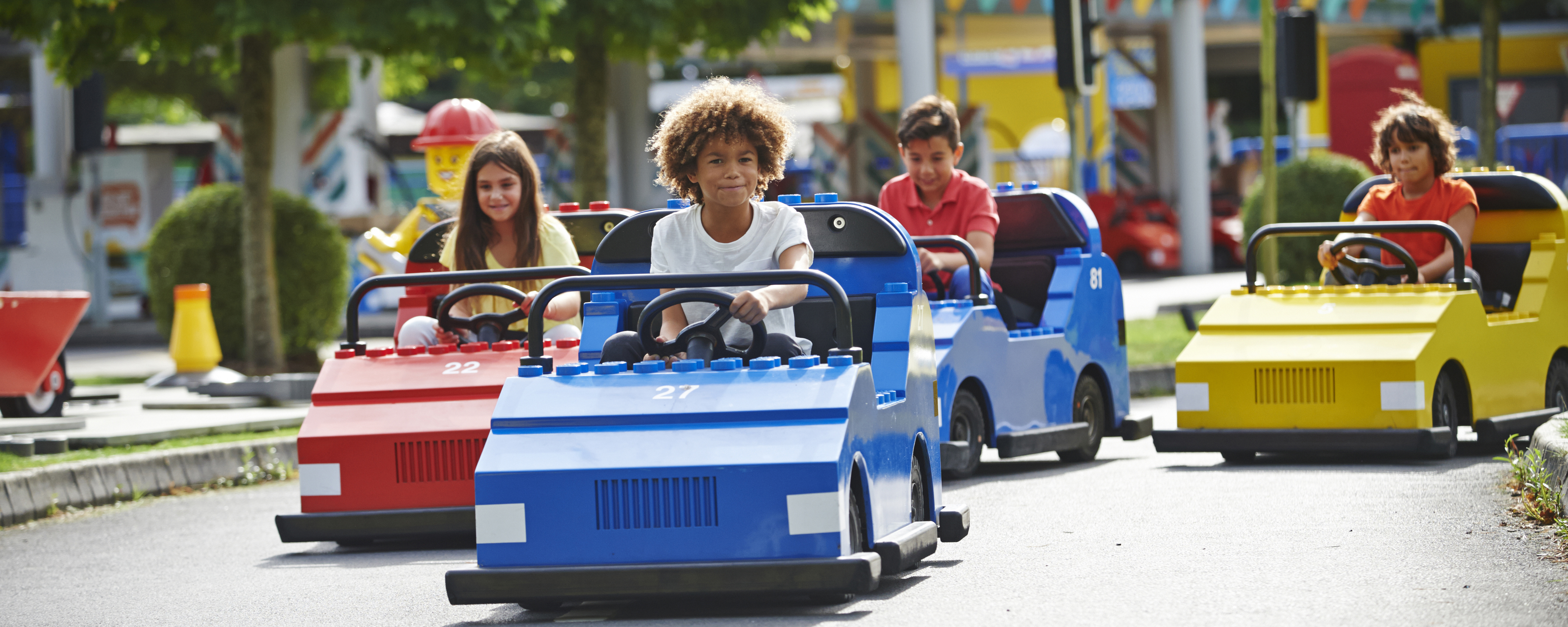 Children driving cars on LEGO® City Driving School at LEGOLAND® Windsor Resort