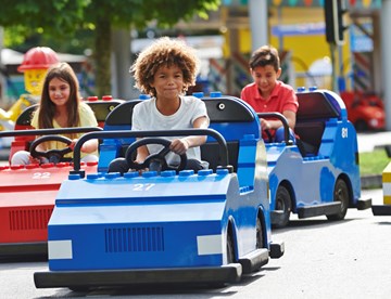 Children driving cars on LEGO® City Driving School at LEGOLAND® Windsor Resort