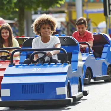 Children driving cars on LEGO® City Driving School at LEGOLAND® Windsor Resort