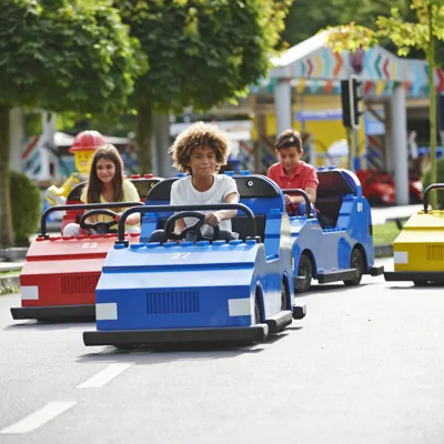 Children driving cars on LEGO® City Driving School at LEGOLAND® Windsor Resort