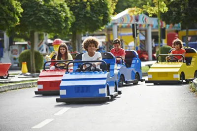 Children driving cars on LEGO® City Driving School at LEGOLAND® Windsor Resort