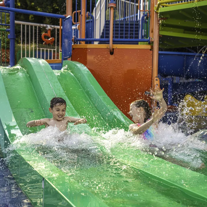 Kids going down slides in Drench Towers at LEGOLAND Windsor
