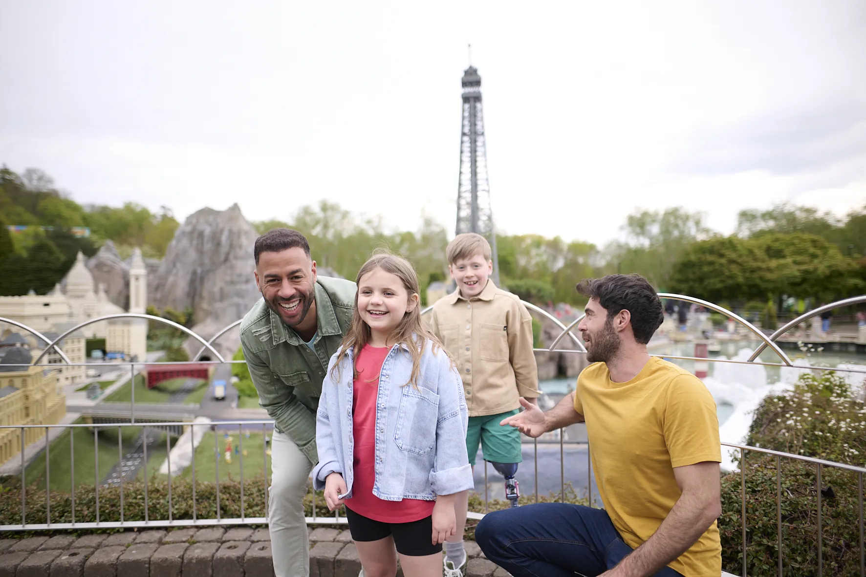 Family In Front Of Paris Section Of Miniland