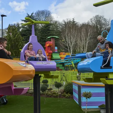 Families laughing and smiling on DUPLO Valley Airport