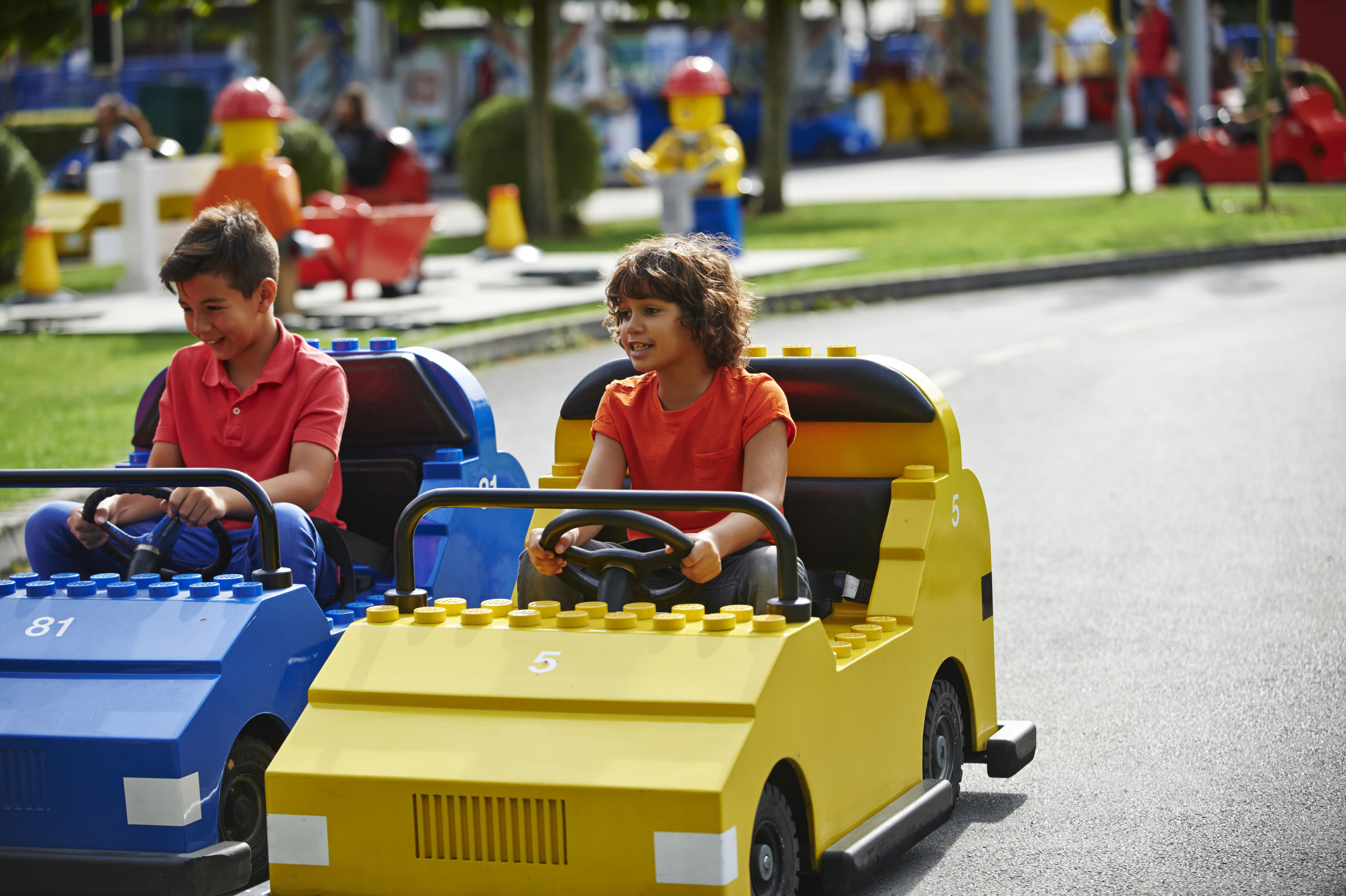 Boys driving cars at LEGO® City Driving School at LEGOLAND® Windsor Resort