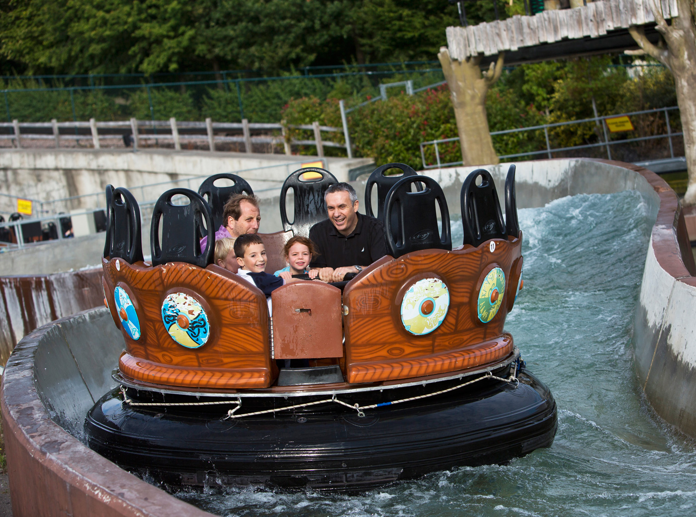 Families getting wet on Viking River Splash rapids ride