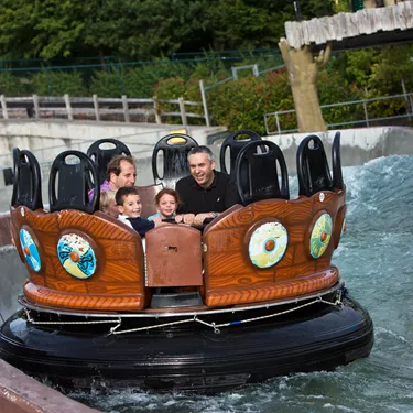 Families getting wet on Viking River Splash rapids ride