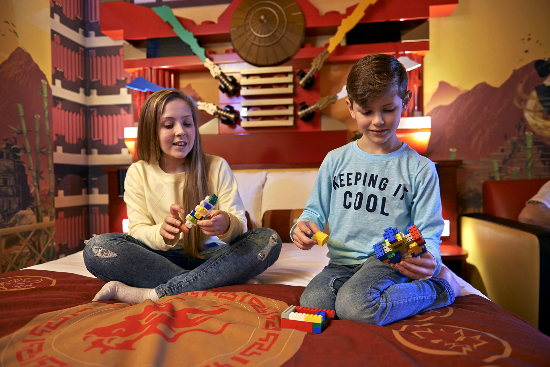 Children playing withe LEGO in the NINJAGO Themed Room at the LEGOLAND Resort Hotel