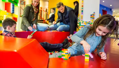 Children playing with LEGO® in the Reception of the LEGOLAND® Resort Hotel