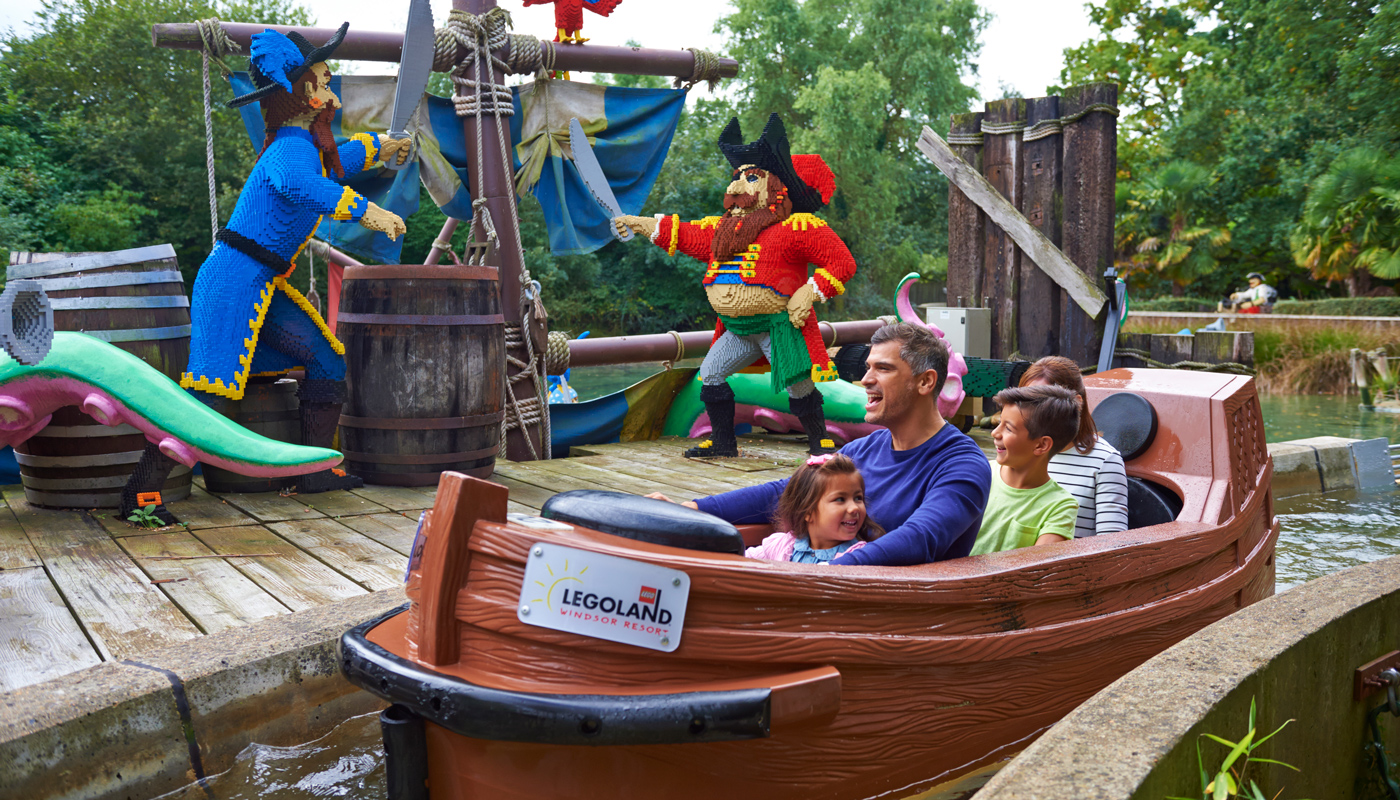 Family with LEGO models on Pirate Falls log flume at the LEGOLAND® Windsor Resort