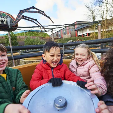 Children laughing and smiling on Spinning Spider at the LEGOLAND Windsor Resort