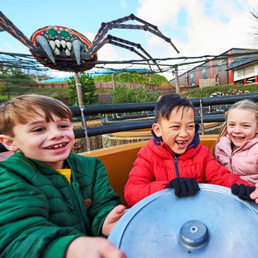 Children laughing and smiling on Spinning Spider at the LEGOLAND Windsor Resort