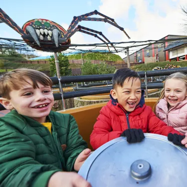 Children laughing and smiling on Spinning Spider at the LEGOLAND Windsor Resort
