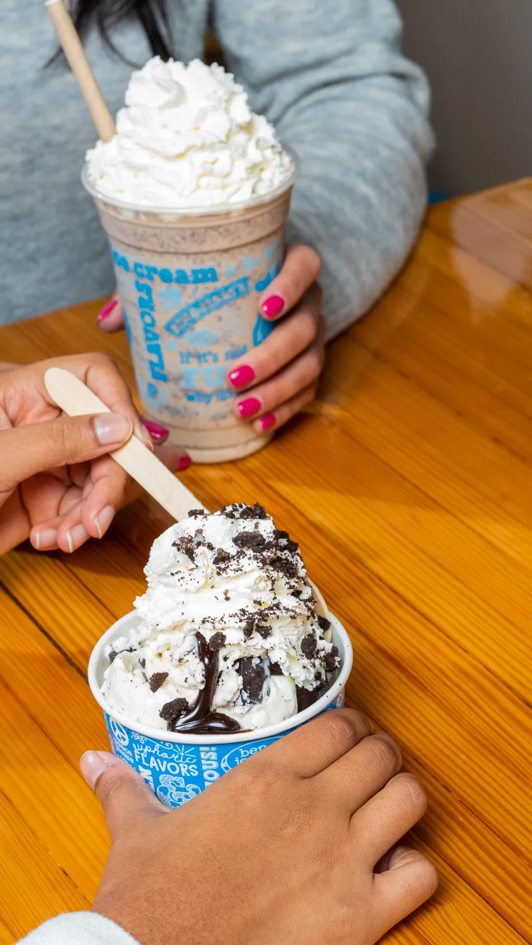 Family drinking milkshake and eating ice cream from Ben & Jerry's at LEGOLAND Windso Resort