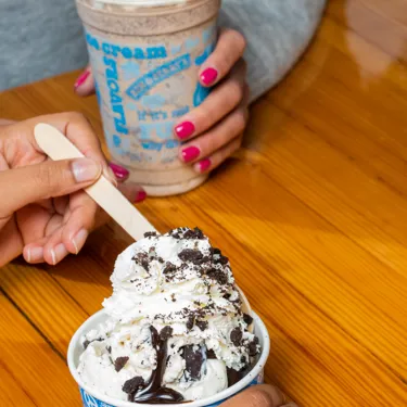 Family drinking milkshake and eating ice cream from Ben & Jerry's at LEGOLAND Windso Resort